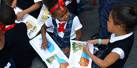 Children reading their customized stories on personalized books - Spin Me a Tale